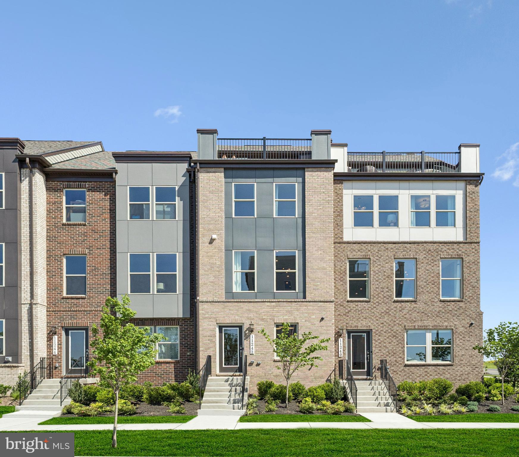 11217 Einstein Street Manassas, VA 20110 - Photo 1 of 26 a view of a building with a yard