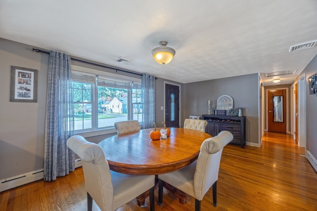 148 Yale Street Ludlow, MA 01056 - Photo 11 of 39 a dining room with furniture and wooden floor