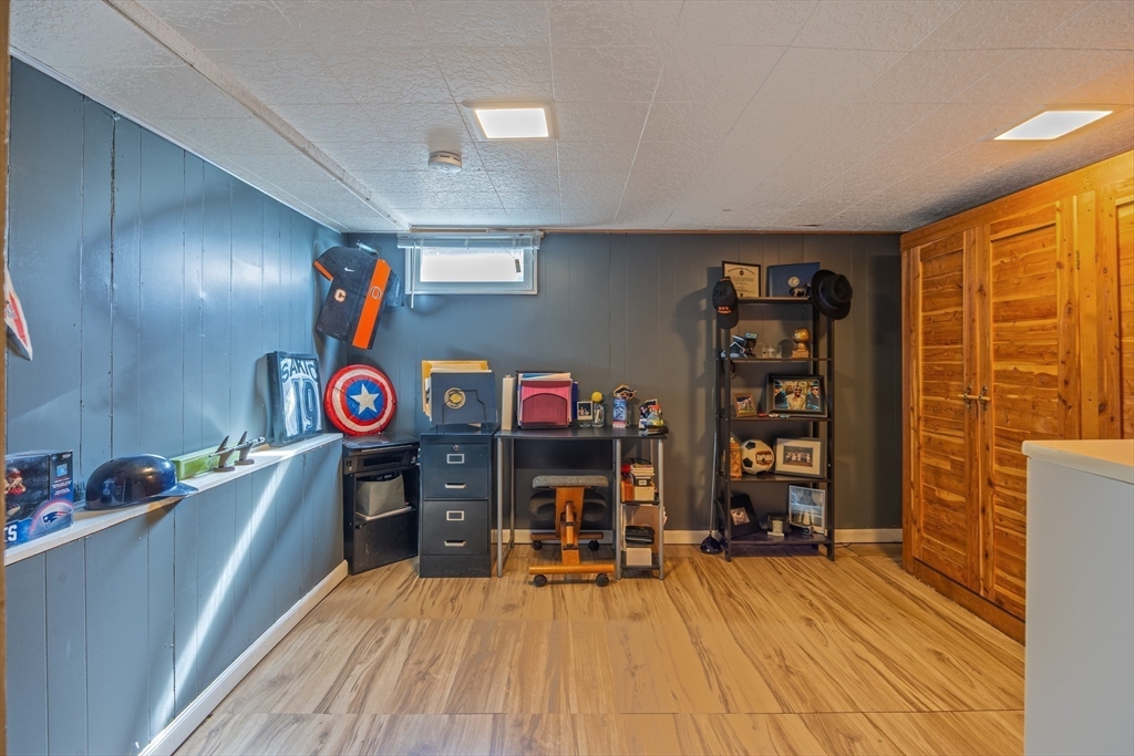 148 Yale Street Ludlow, MA 01056 - Photo 30 of 39 a room with furniture and a flat screen tv