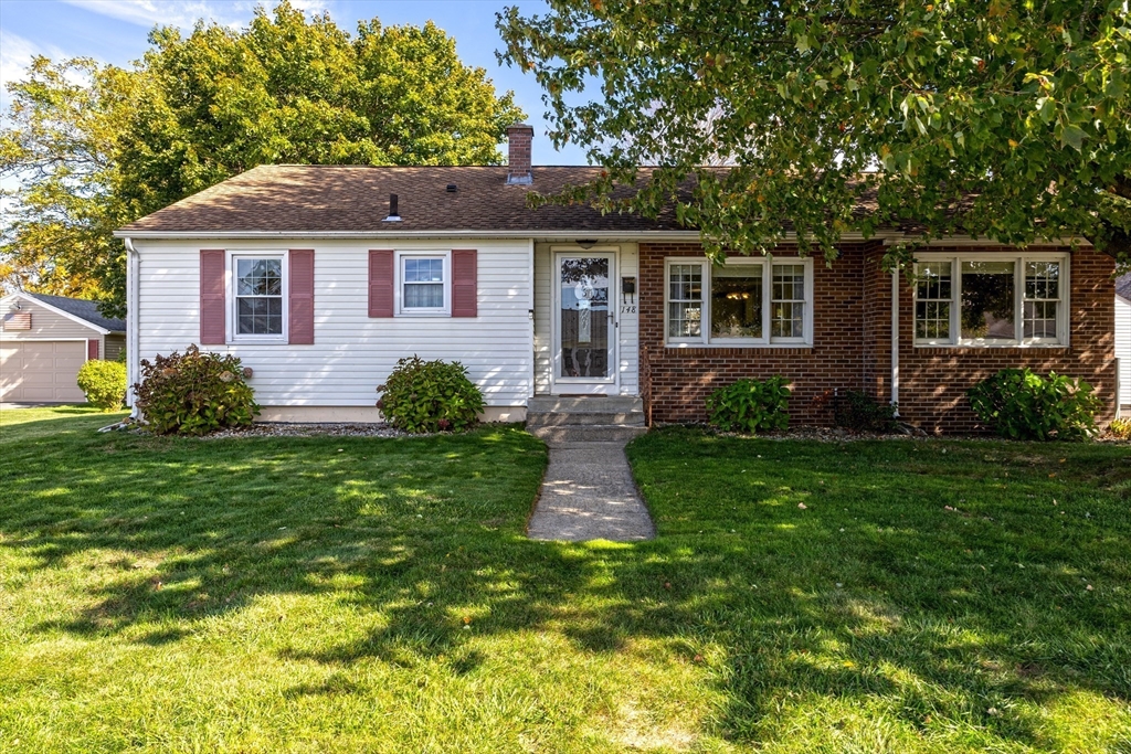 148 Yale Street Ludlow, MA 01056 - Photo 3 of 39 a front view of a house with garden