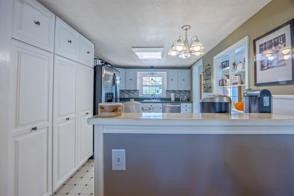 148 Yale Street Ludlow, MA 01056 - Photo 10 of 39 a view of kitchen with cabinets and wooden floor
