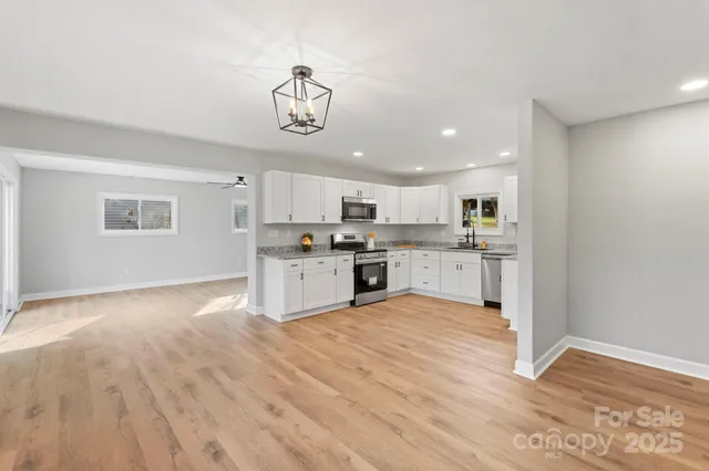 a view of kitchen with wooden floor