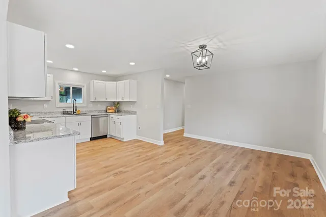 a view of kitchen with wooden floor