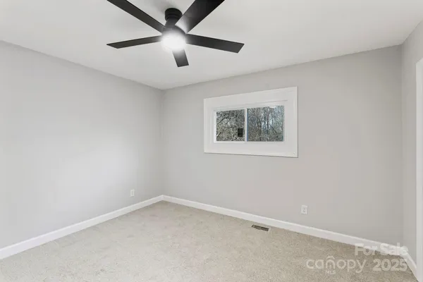 a bedroom with a bed and a table