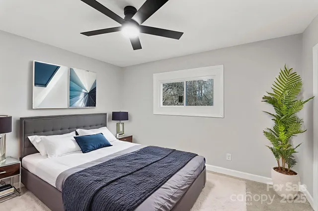 a bathroom with a sink toilet vanity and shower