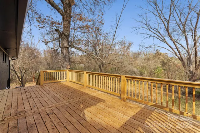 a view of a pathway of a house with a yard