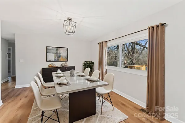 a dining room with furniture and window