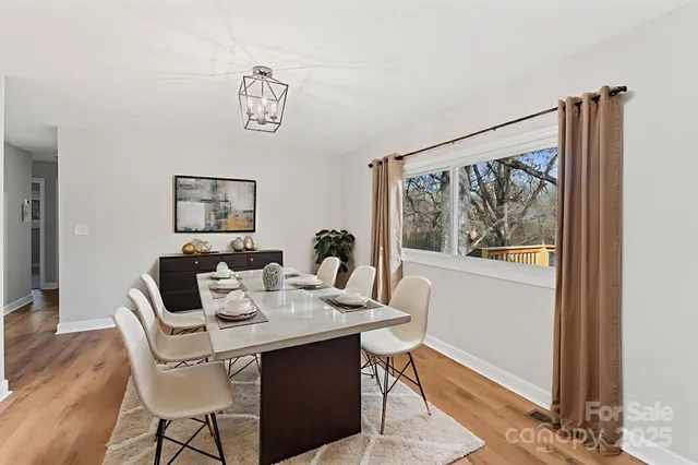 a dining room with furniture and window