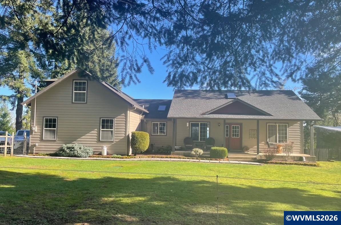1110 Reuben Boise Road Dallas, OR 97338 - Photo 1 of 49 a front view of a house with garden