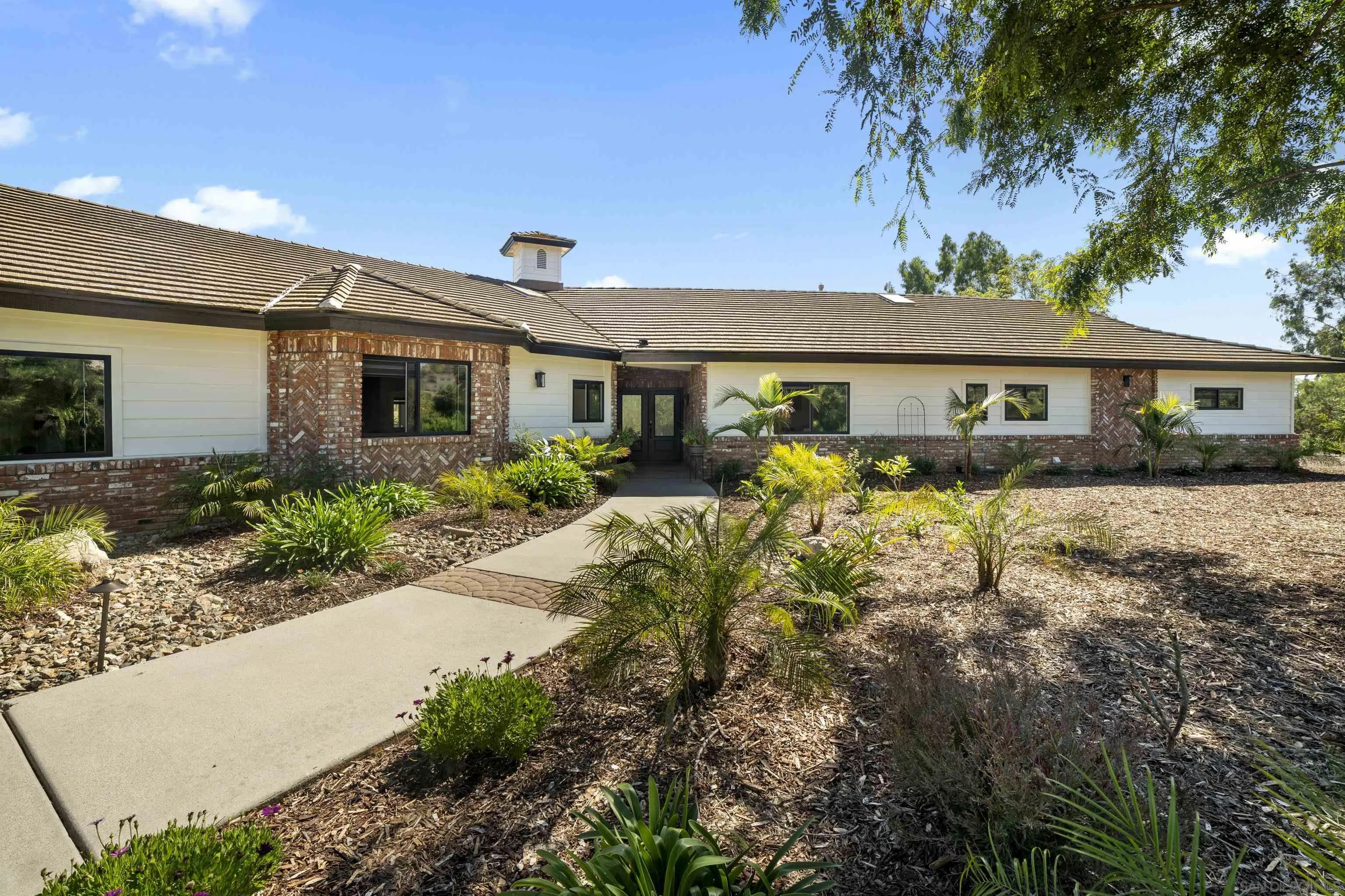 4062 La Canada Road Fallbrook, CA 92028 - Photo 1 of 63 a front view of a house with garden