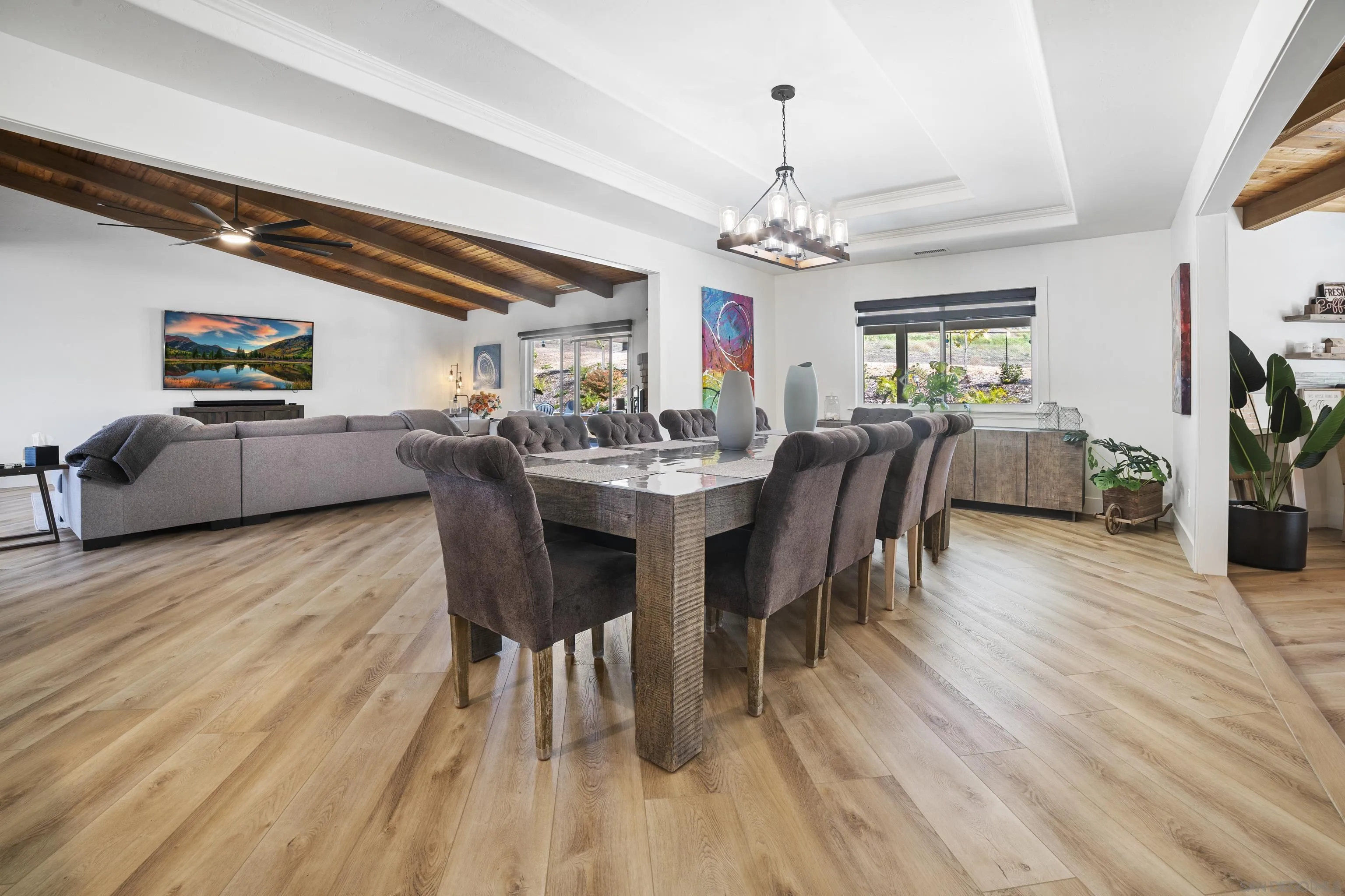 4062 La Canada Road Fallbrook, CA 92028 - Photo 12 of 63 a view of a dining room with furniture a chandelier and wooden floor