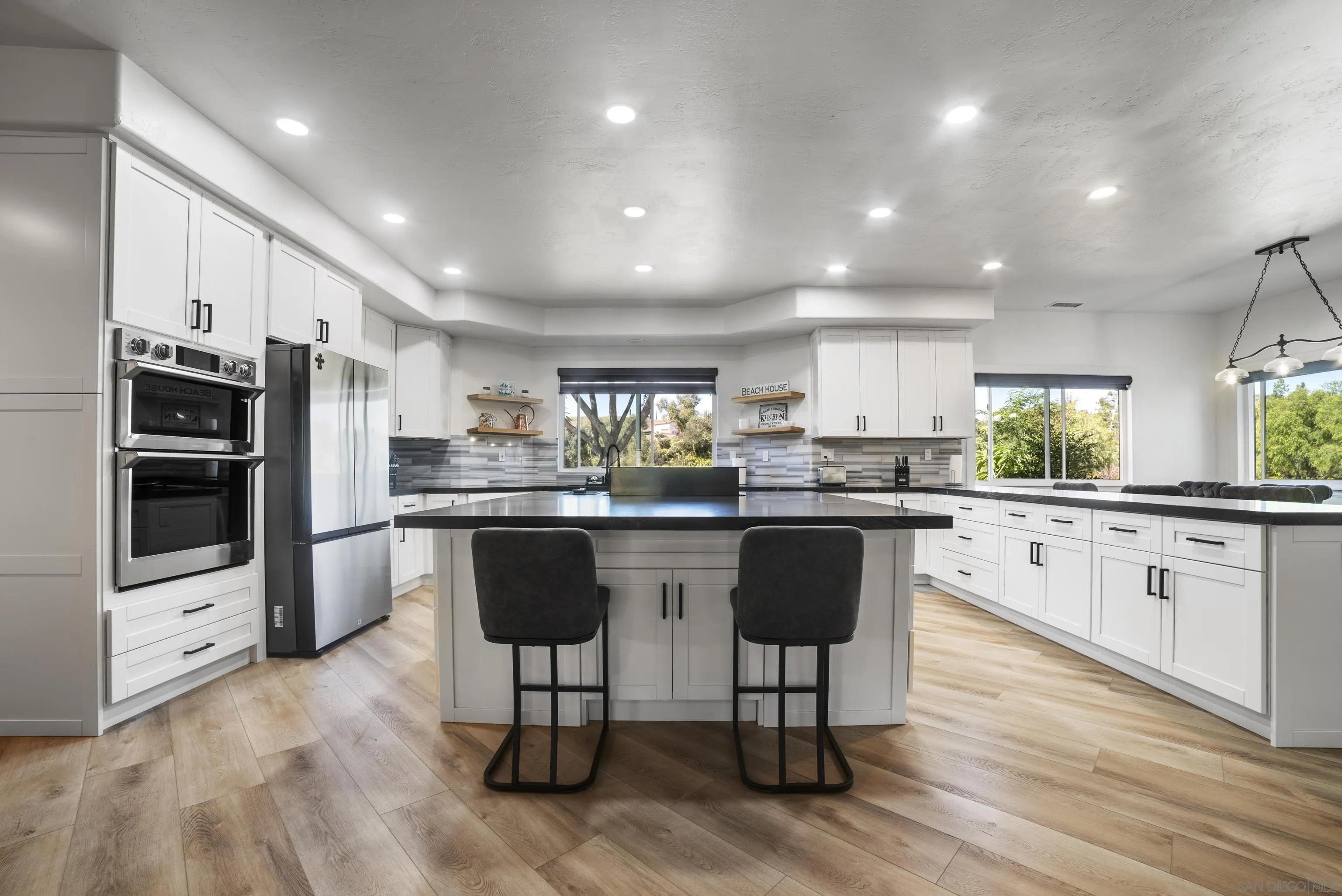 4062 La Canada Road Fallbrook, CA 92028 - Photo 18 of 63 a kitchen with a sink cabinets and stainless steel appliances