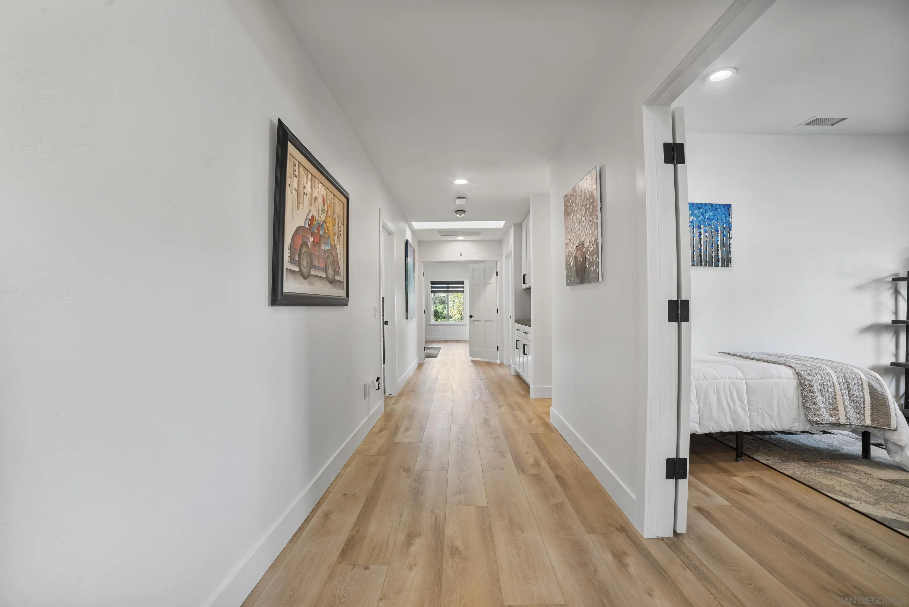 4062 La Canada Road Fallbrook, CA 92028 - Photo 27 of 63 a view of a hallway with wooden floor and closet