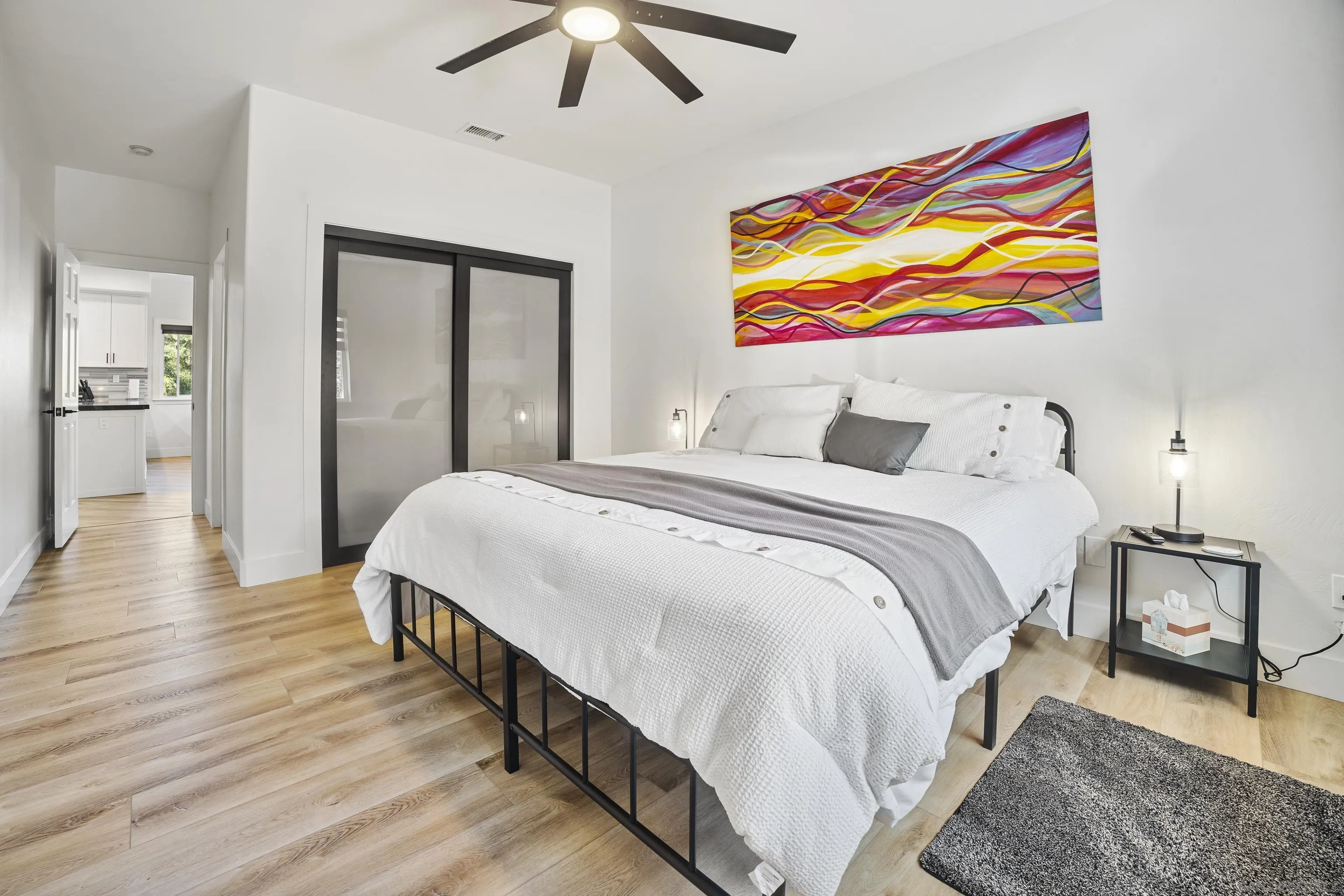 4062 La Canada Road Fallbrook, CA 92028 - Photo 29 of 63 a spacious bedroom with a bed and a painting on the wall
