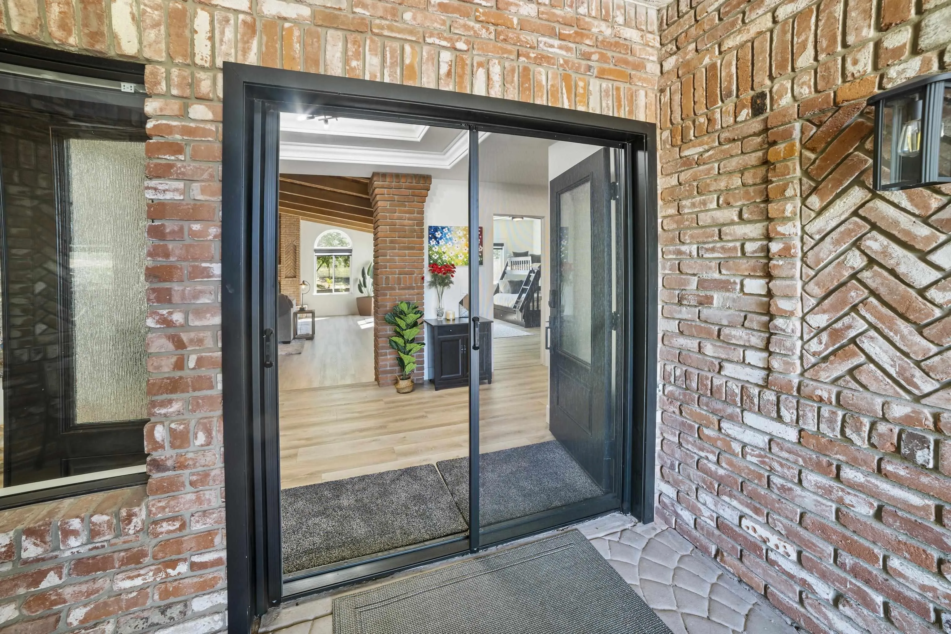 4062 La Canada Road Fallbrook, CA 92028 - Photo 3 of 63 a view of a entryway front of a brick building
