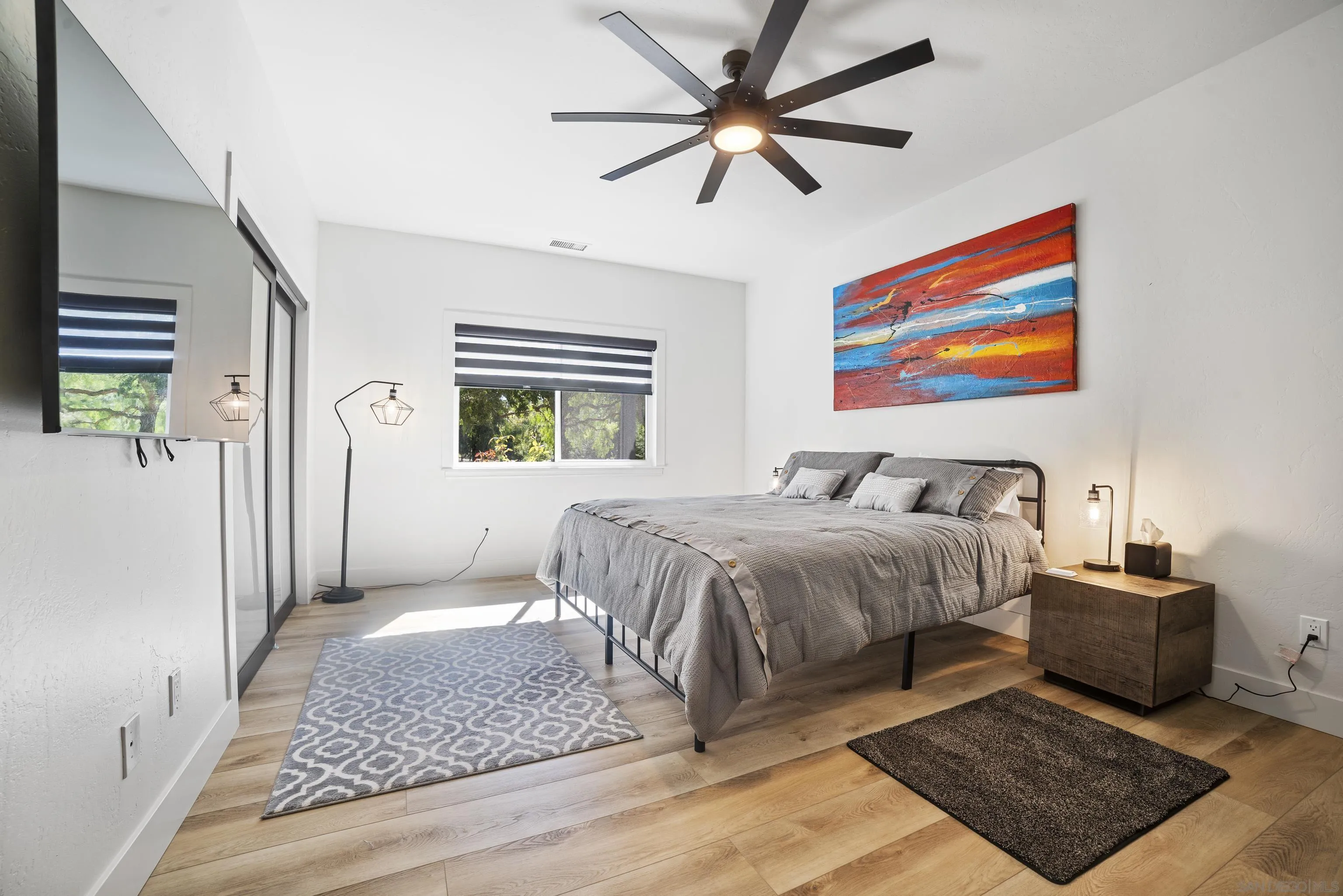 4062 La Canada Road Fallbrook, CA 92028 - Photo 31 of 63 a spacious bedroom with a bed and a chandelier