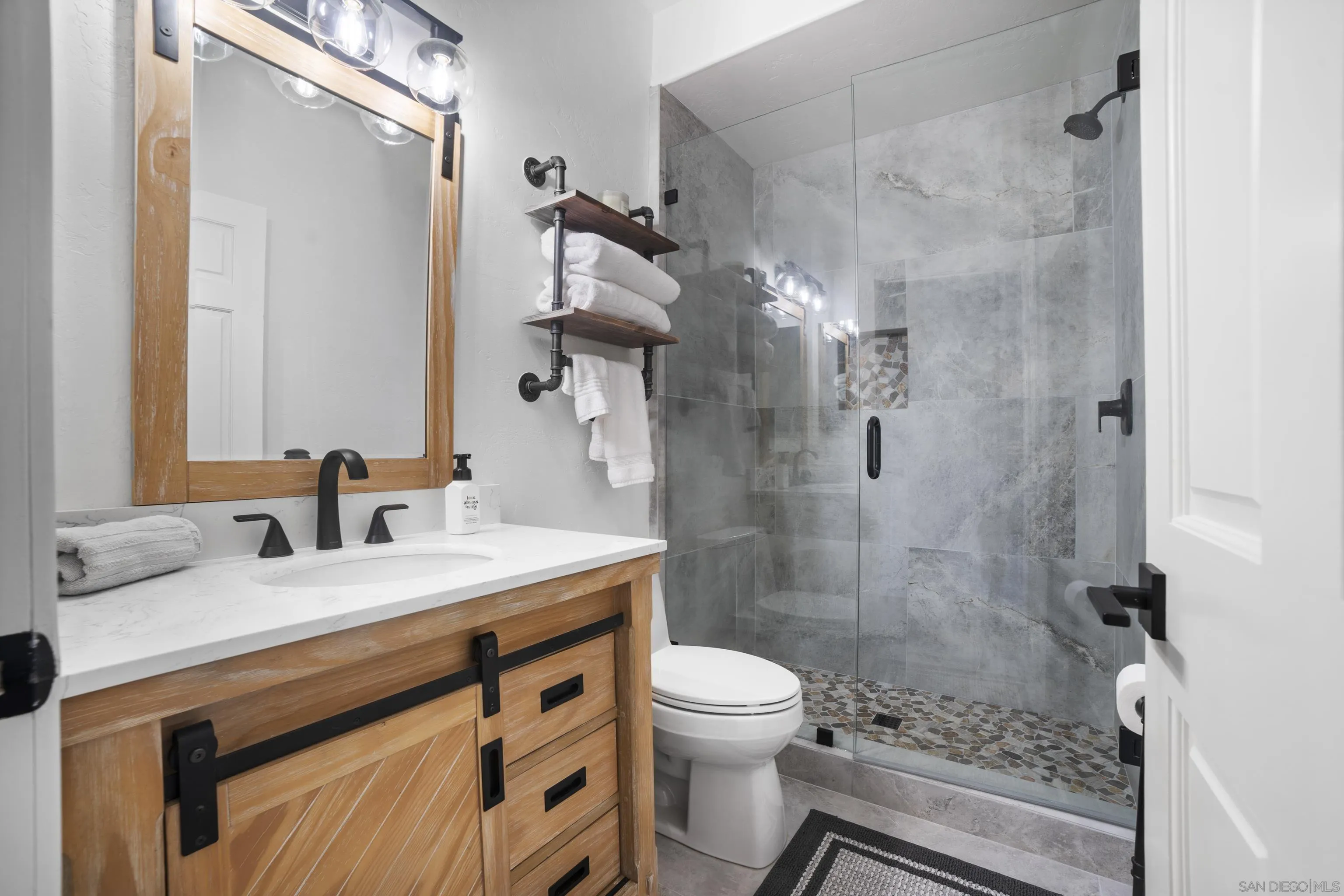 4062 La Canada Road Fallbrook, CA 92028 - Photo 34 of 63 a bathroom with a sink a toilet and shower