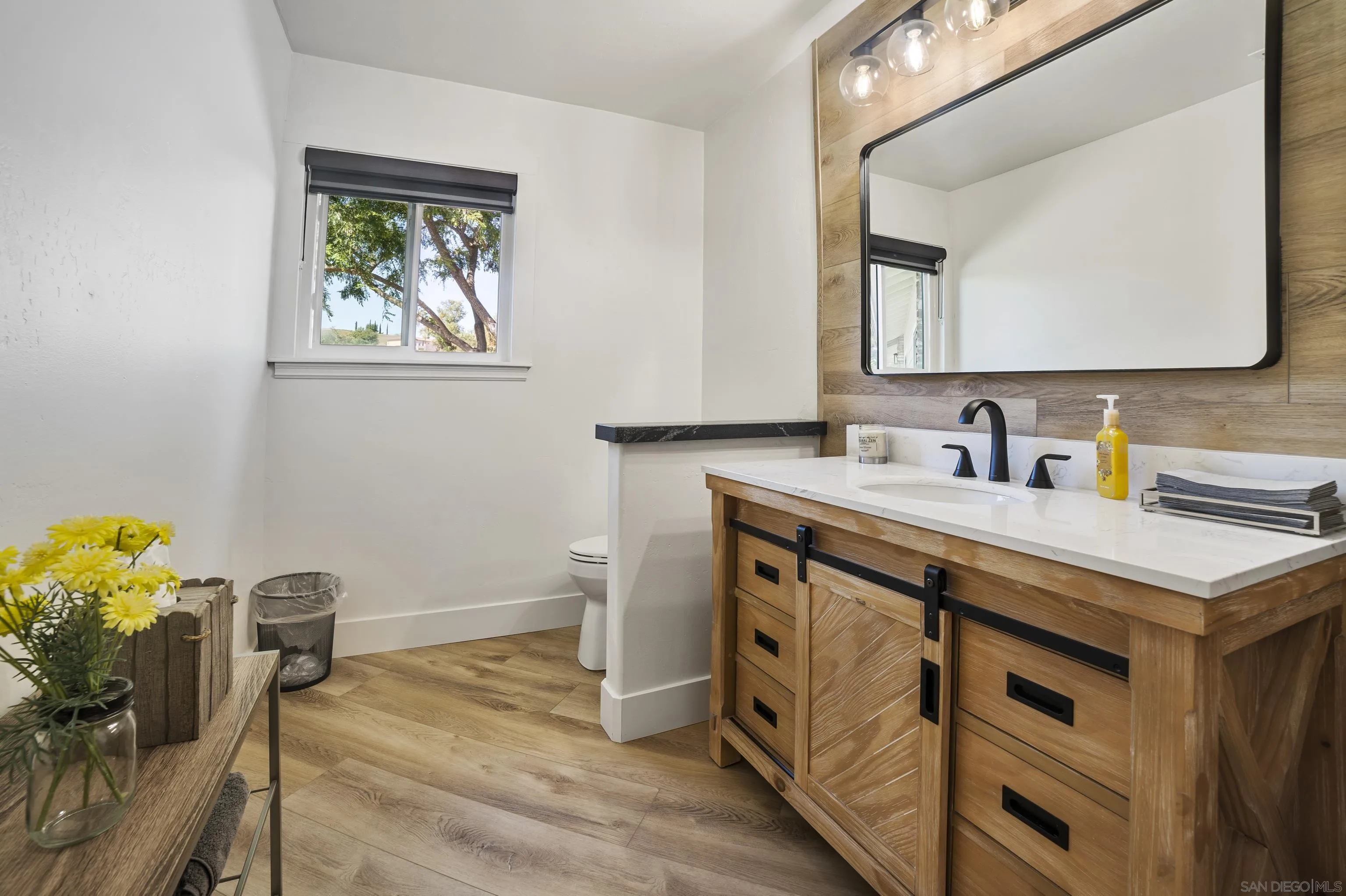 4062 La Canada Road Fallbrook, CA 92028 - Photo 35 of 63 a bathroom with a sink and a mirror