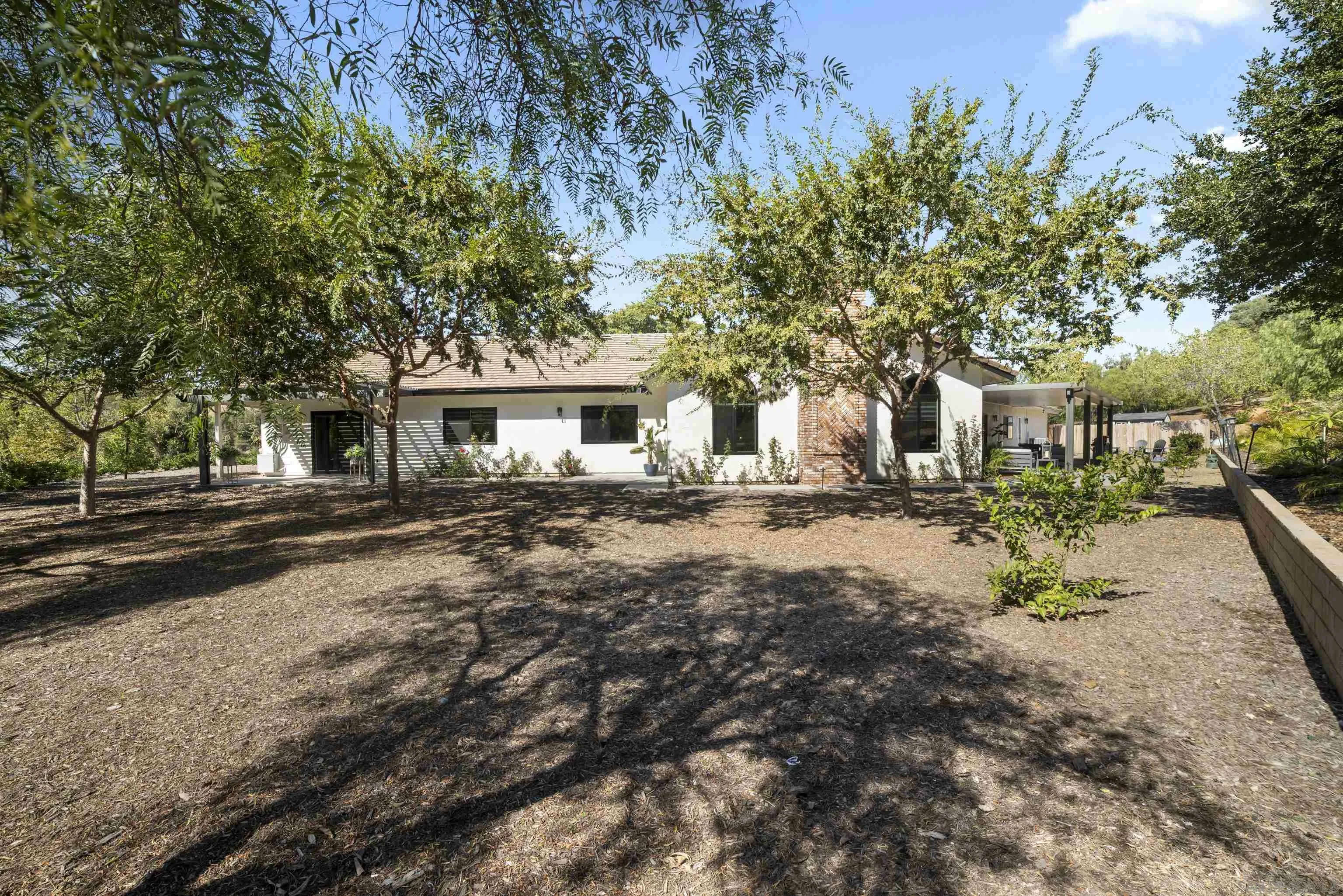 4062 La Canada Road Fallbrook, CA 92028 - Photo 46 of 63 a front view of a house with a yard