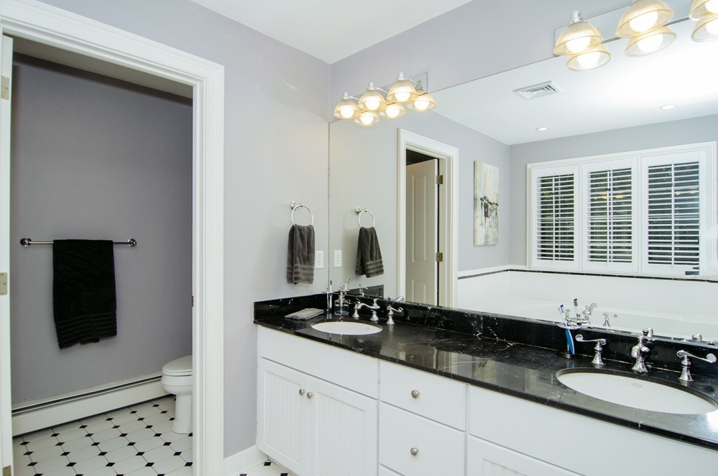 52 Locust Avenue Lexington, MA 02421 - Photo 13 of 28 a bathroom with double sink and a mirror