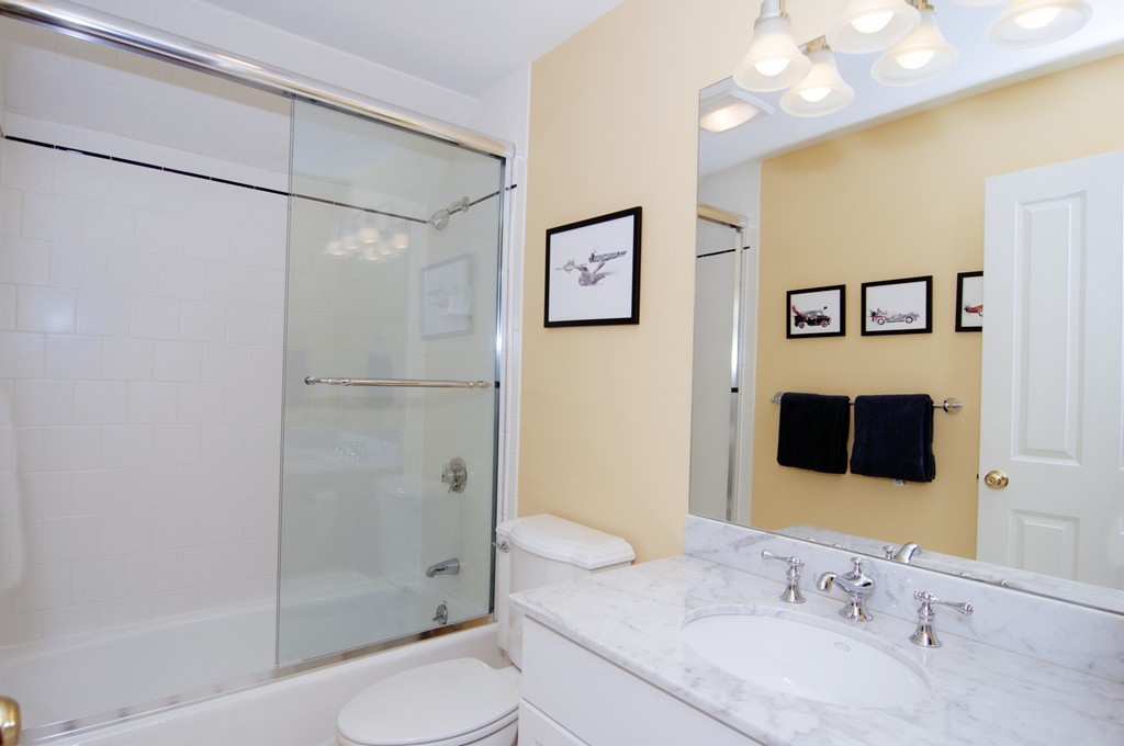 52 Locust Avenue Lexington, MA 02421 - Photo 19 of 28 a bathroom with a granite countertop sink toilet and shower