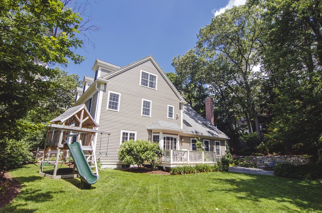52 Locust Avenue Lexington, MA 02421 - Photo 23 of 28 a front view of a house with a yard and green space