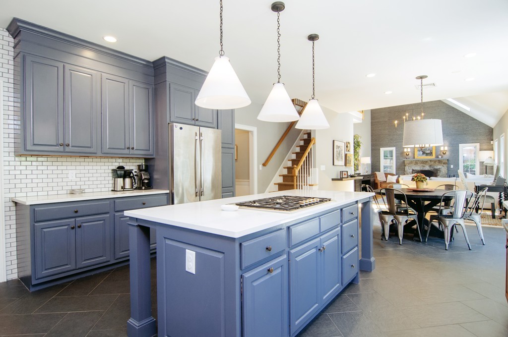 52 Locust Avenue Lexington, MA 02421 - Photo 6 of 28 a kitchen with a stove a sink a dining table and chairs