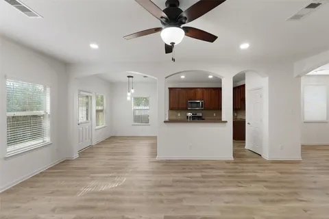 a view of a kitchen with a sink and a window