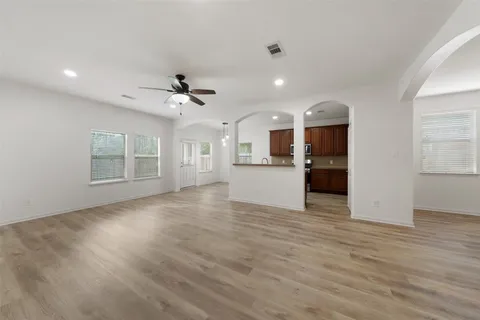 a view of a kitchen with a sink and a window