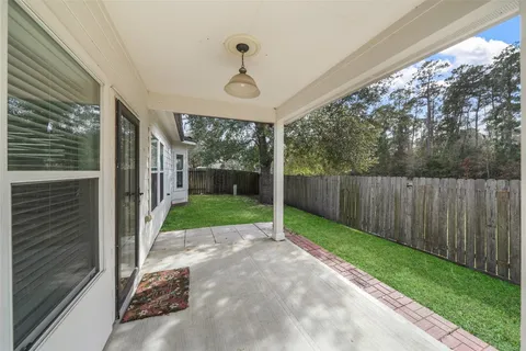 a view of a house with a yard and porch