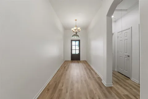 a view of entryway with wooden floor and window