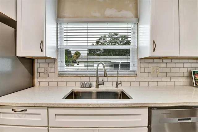 a kitchen with a sink and a window