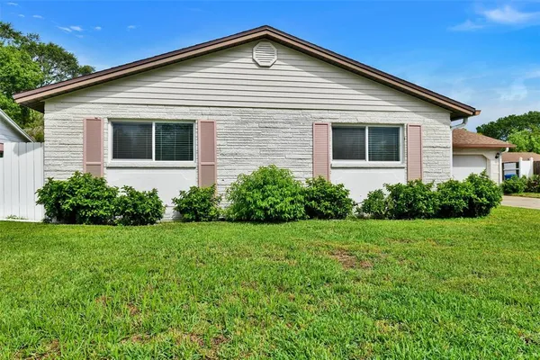 a front view of house with a yard