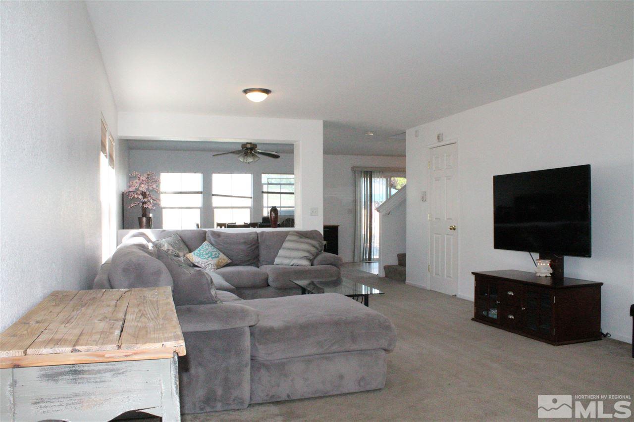 7757 Welsh Drive Reno, NV 89506 - Photo 5 of 23 a living room with furniture and a flat screen tv
