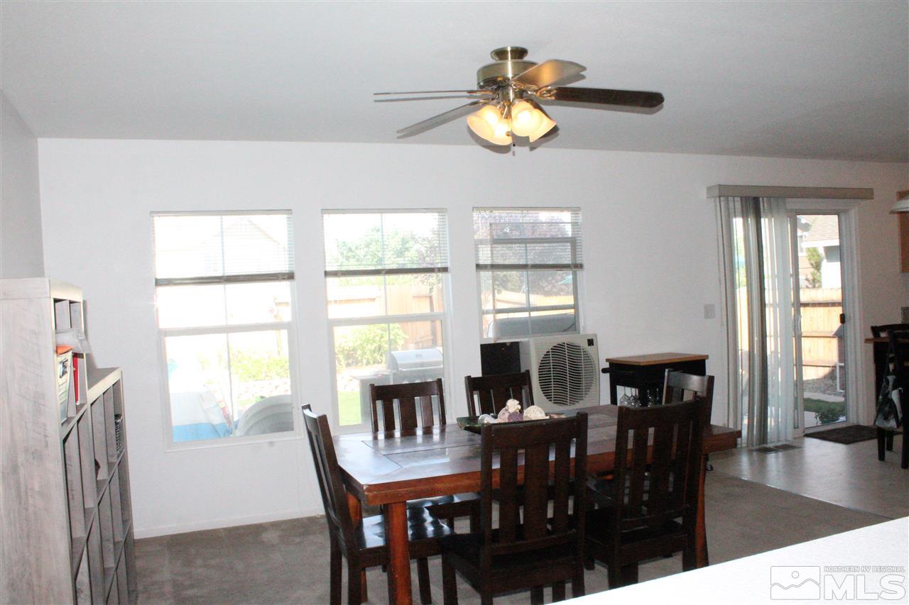 7757 Welsh Drive Reno, NV 89506 - Photo 6 of 23 a view of a dining room with furniture and chandelier