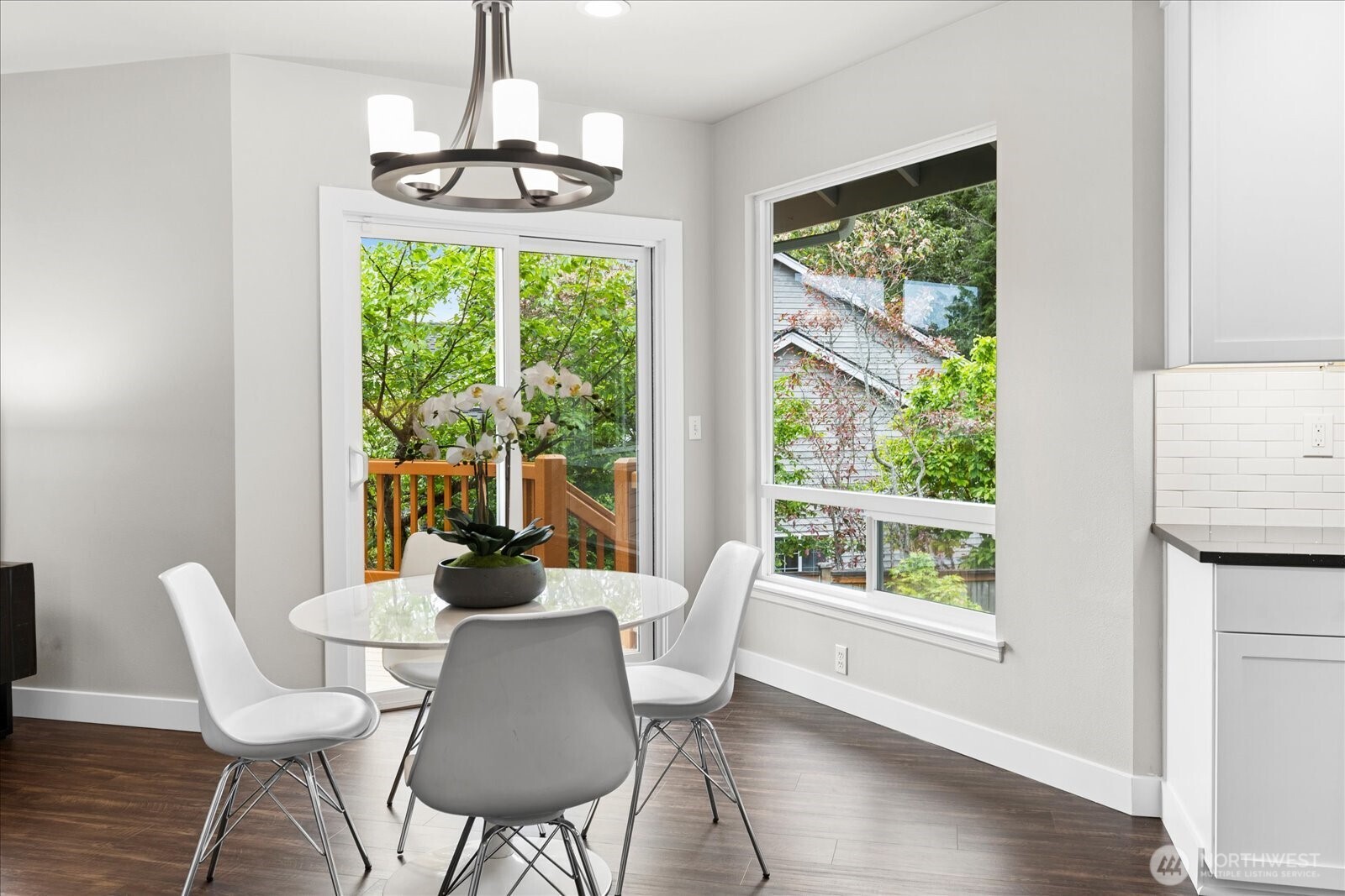 20012 27th Drive Southeast Bothell, WA 98012 - Photo 13 of 39 a dining room with wooden floor a chandelier and wooden floor