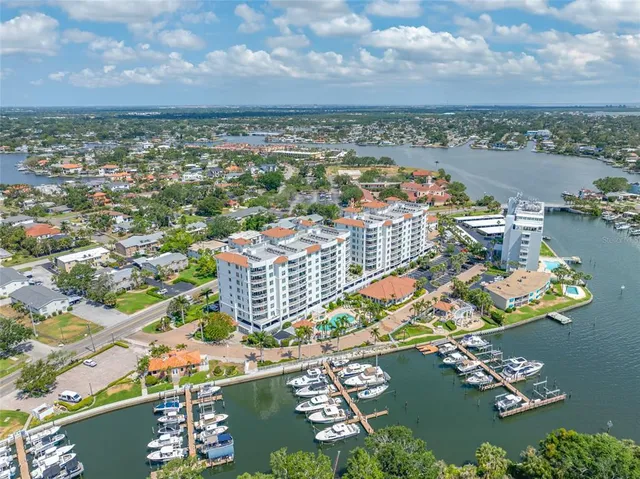 an aerial view of a city with ocean