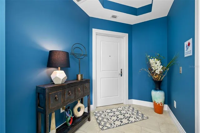 a view of hallway with chandelier