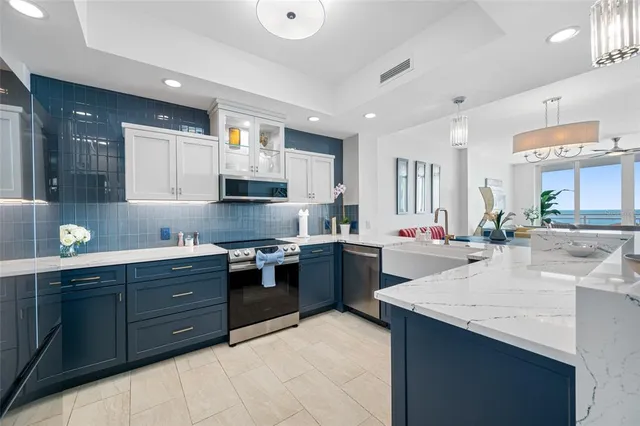 a kitchen with granite countertop a sink and cabinets