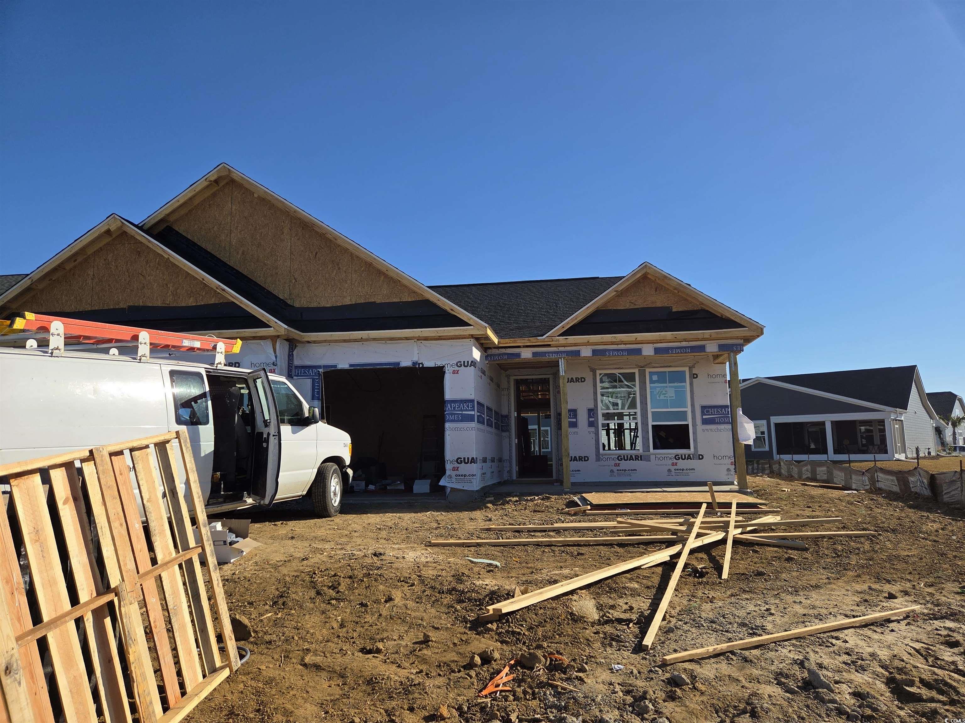 723 St Vincent Loop Little River, SC 29566 - Photo 1 of 1 View of front facade with a shingled roof