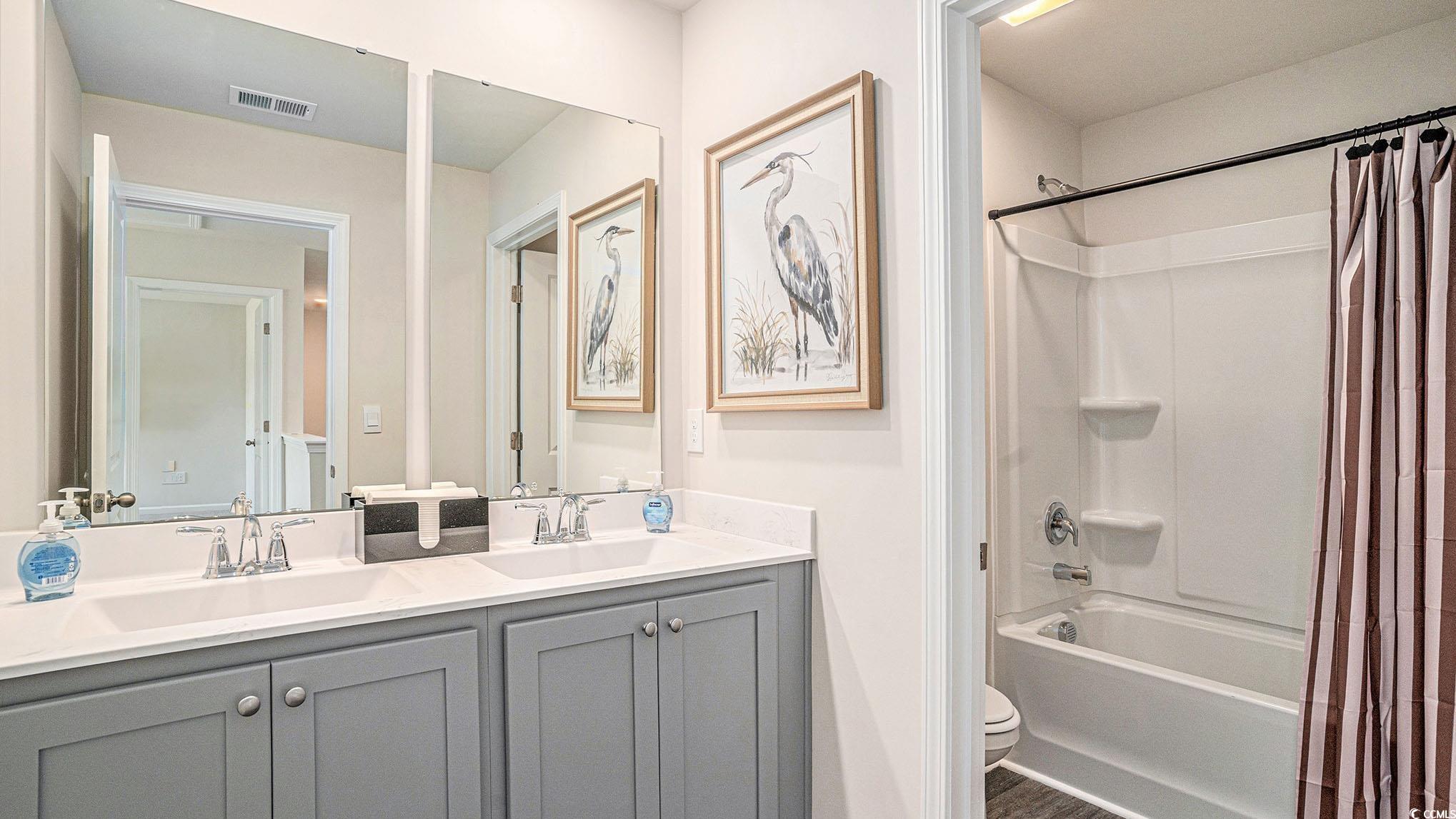 183 Pampa Drive Loris, SC 29569 - Photo 15 of 22 Full bath featuring shower / bath combo with shower curtain and double vanity