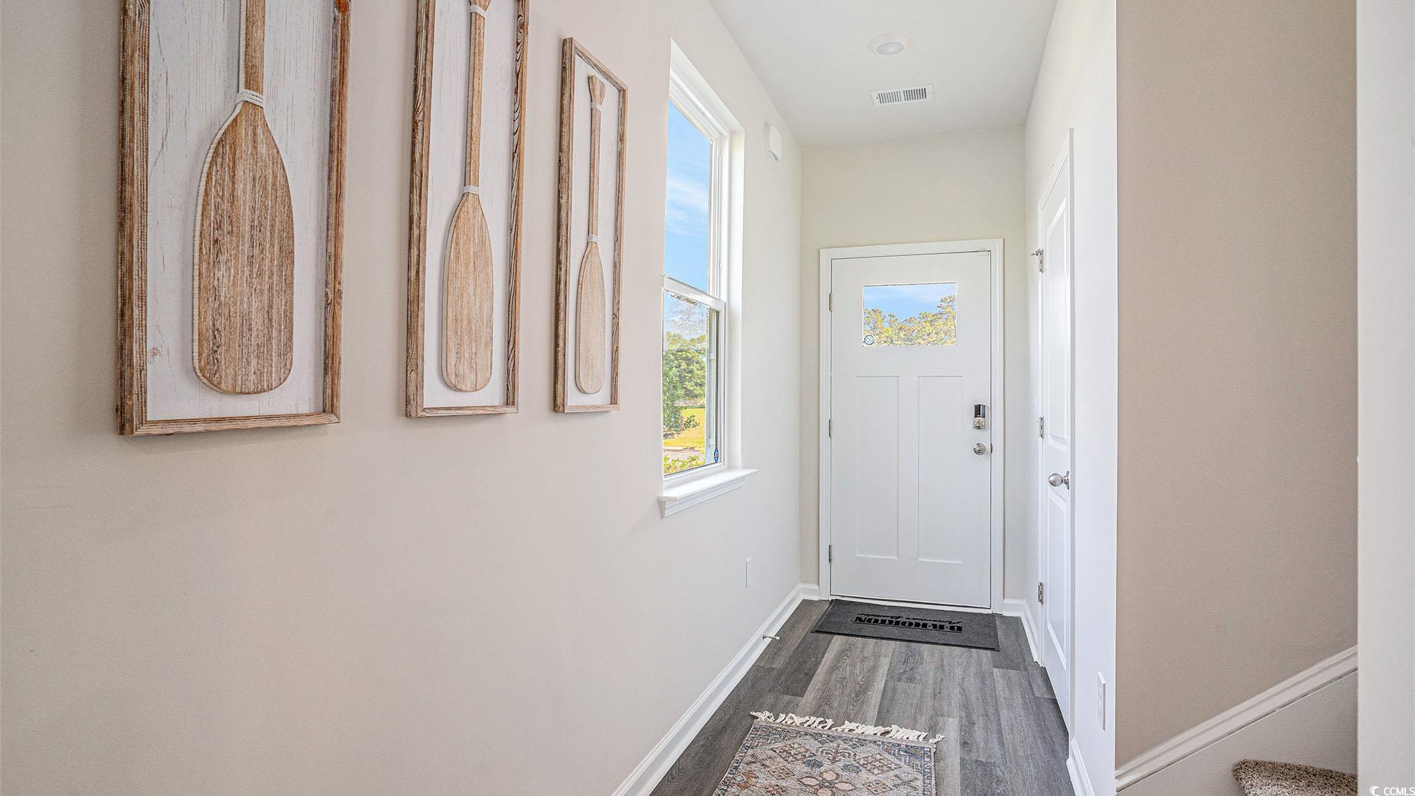 183 Pampa Drive Loris, SC 29569 - Photo 3 of 22 Entryway featuring wood finished floors and baseboards