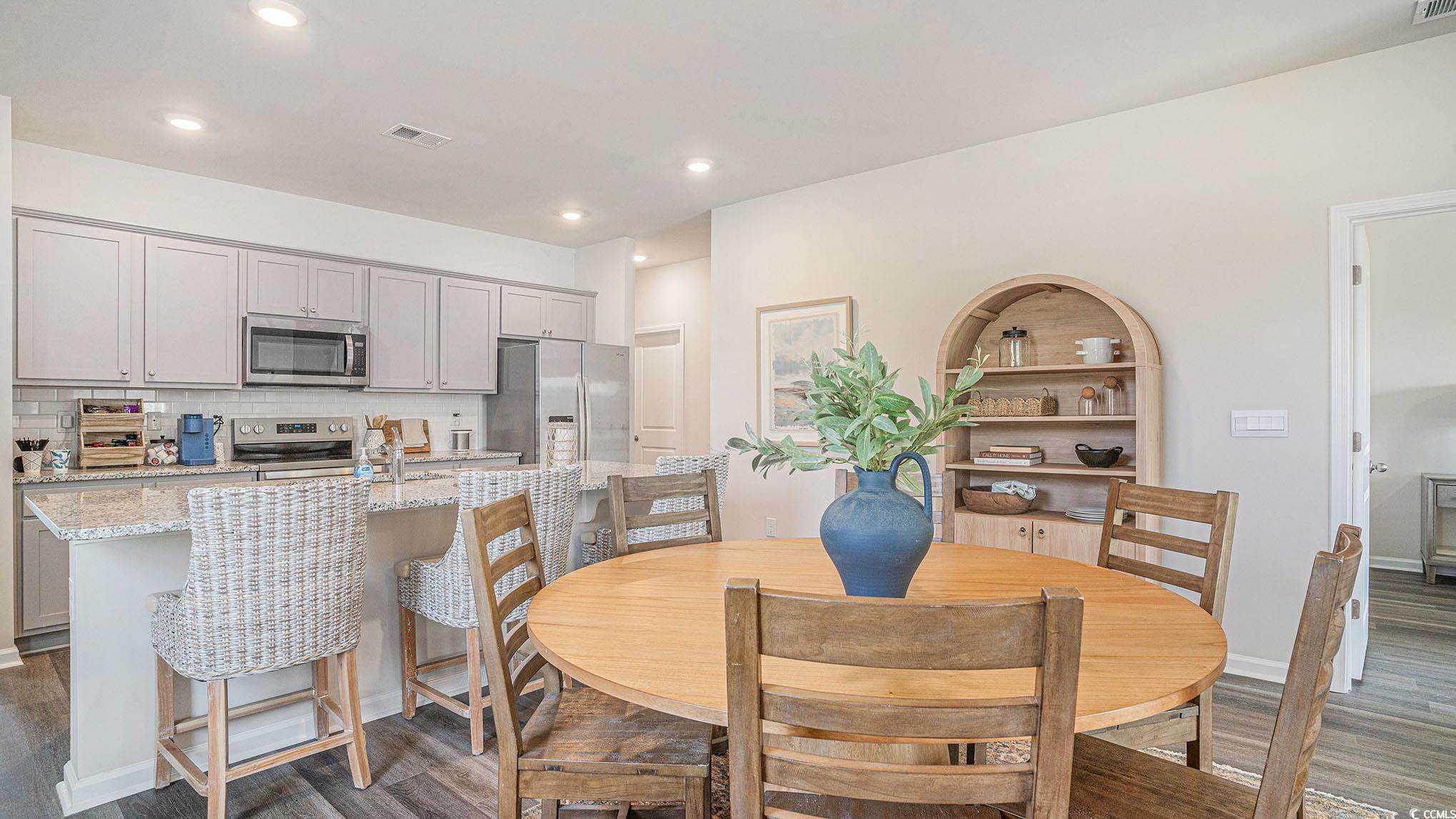 183 Pampa Drive Loris, SC 29569 - Photo 7 of 22 Dining area with dark wood-style floors and recessed lighting