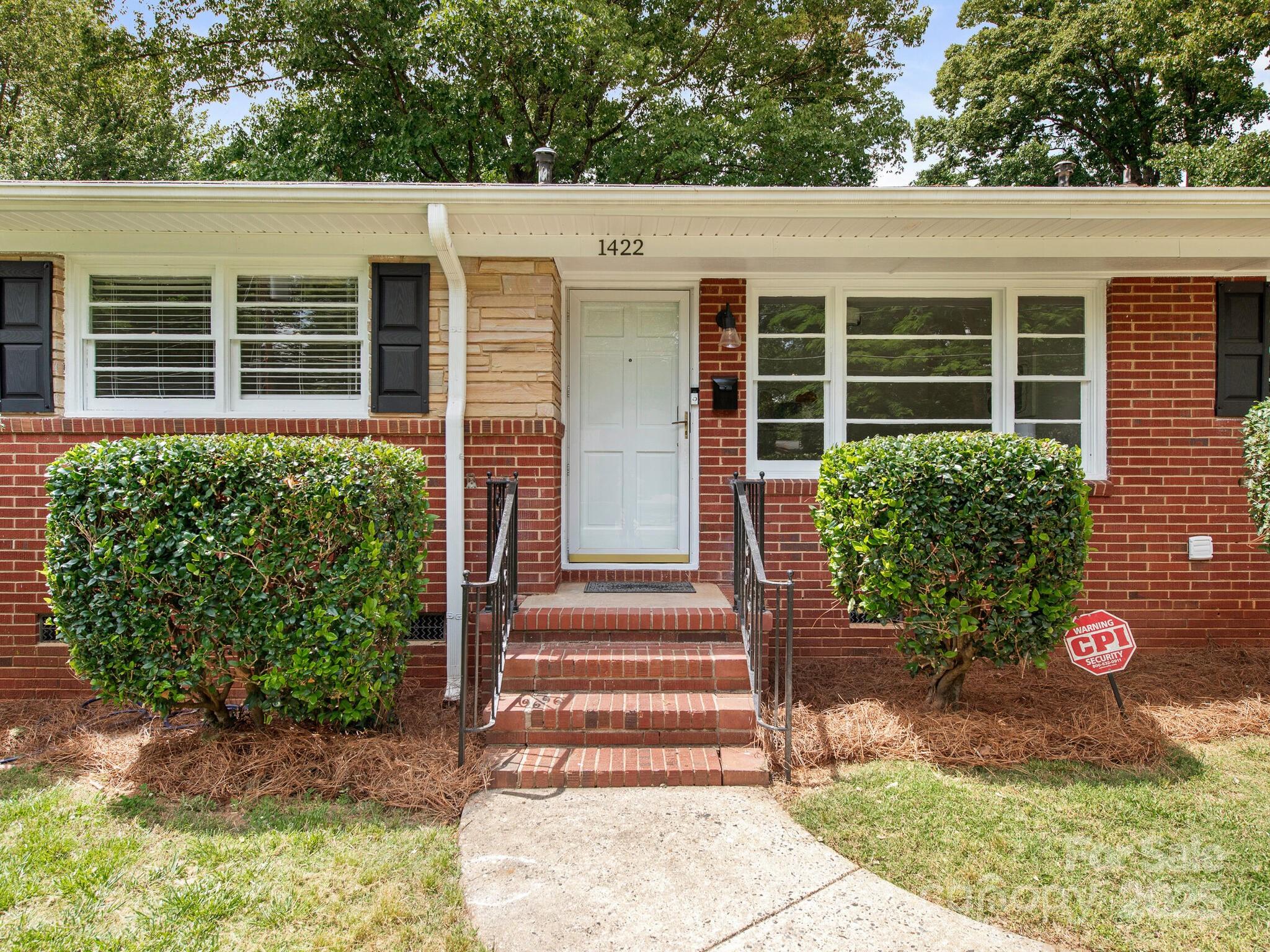 1422 Burnley Road Charlotte, NC 28210 - Photo 2 of 29 a front view of a house