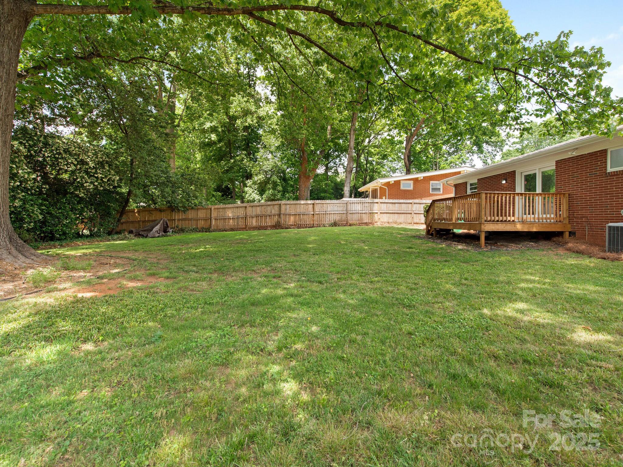 1422 Burnley Road Charlotte, NC 28210 - Photo 28 of 29 a view of a house with a backyard
