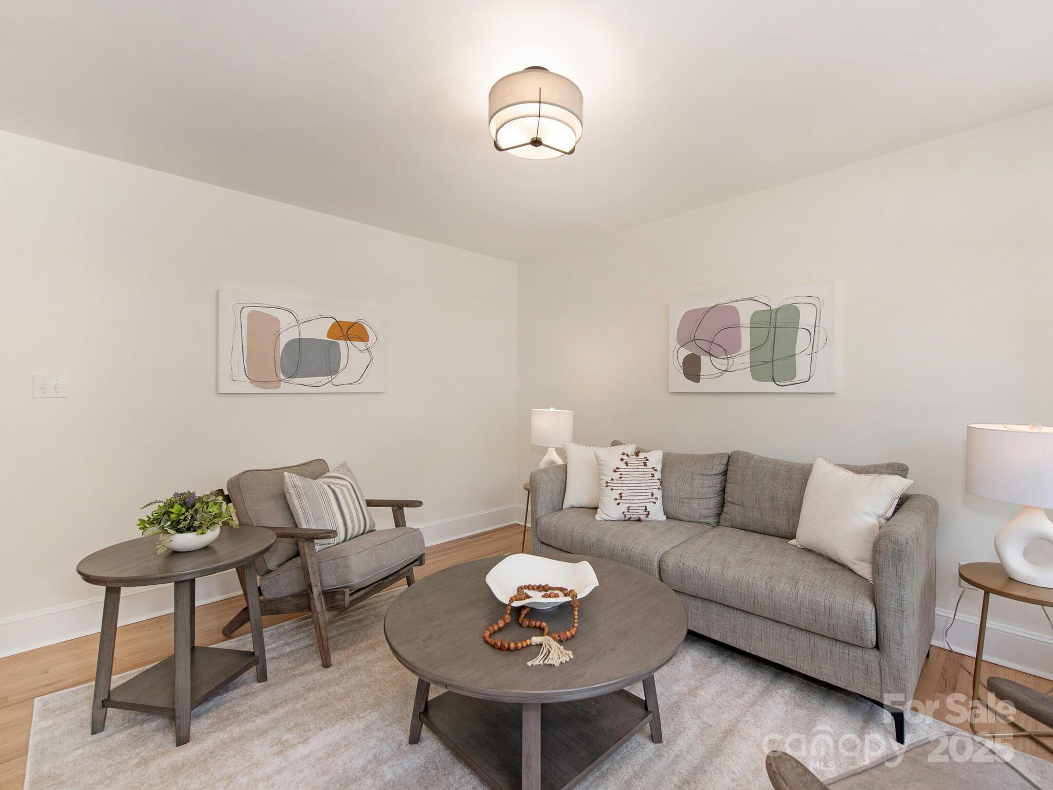 1422 Burnley Road Charlotte, NC 28210 - Photo 4 of 29 a living room with furniture and a table