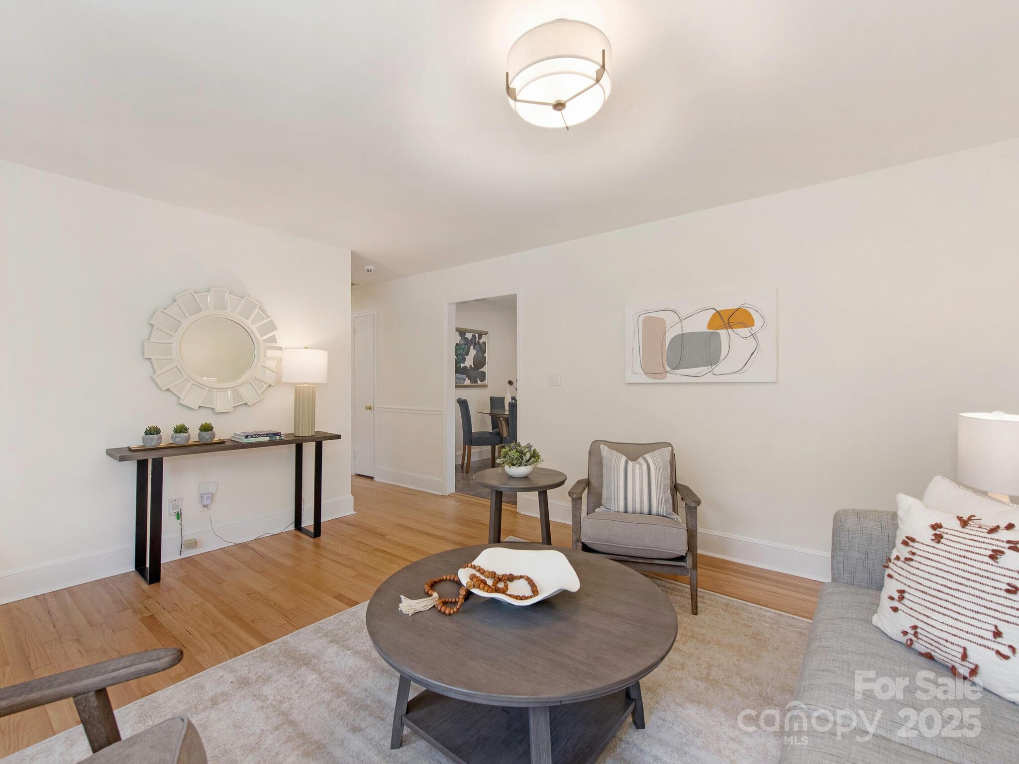 1422 Burnley Road Charlotte, NC 28210 - Photo 7 of 29 a living room with furniture and a table