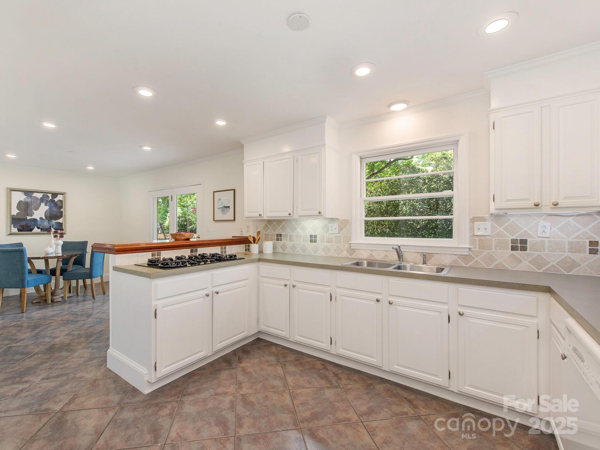 1422 Burnley Road Charlotte, NC 28210 - Photo 10 of 29 a kitchen with sink and cabinets