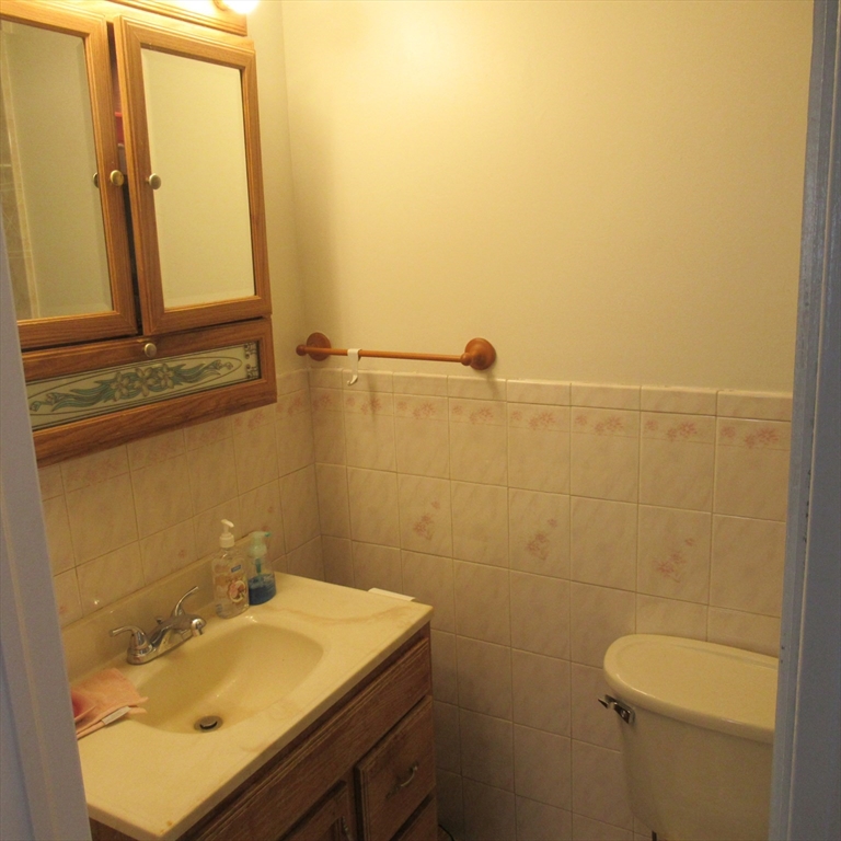 29 Villa Avenue Everett, MA 02149 - Photo 11 of 16 a bathroom with a sink a toilet and mirror