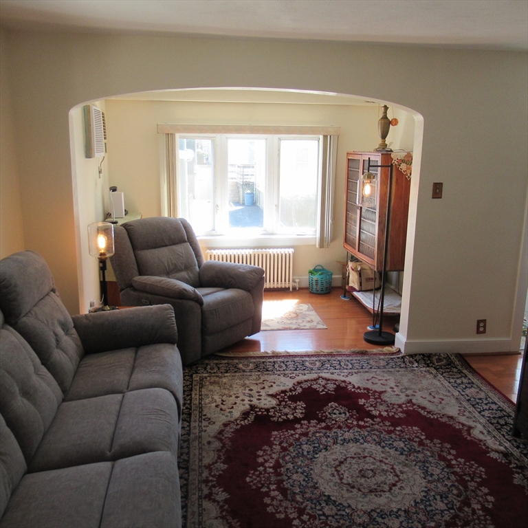 29 Villa Avenue Everett, MA 02149 - Photo 12 of 16 a living room with furniture and a large window